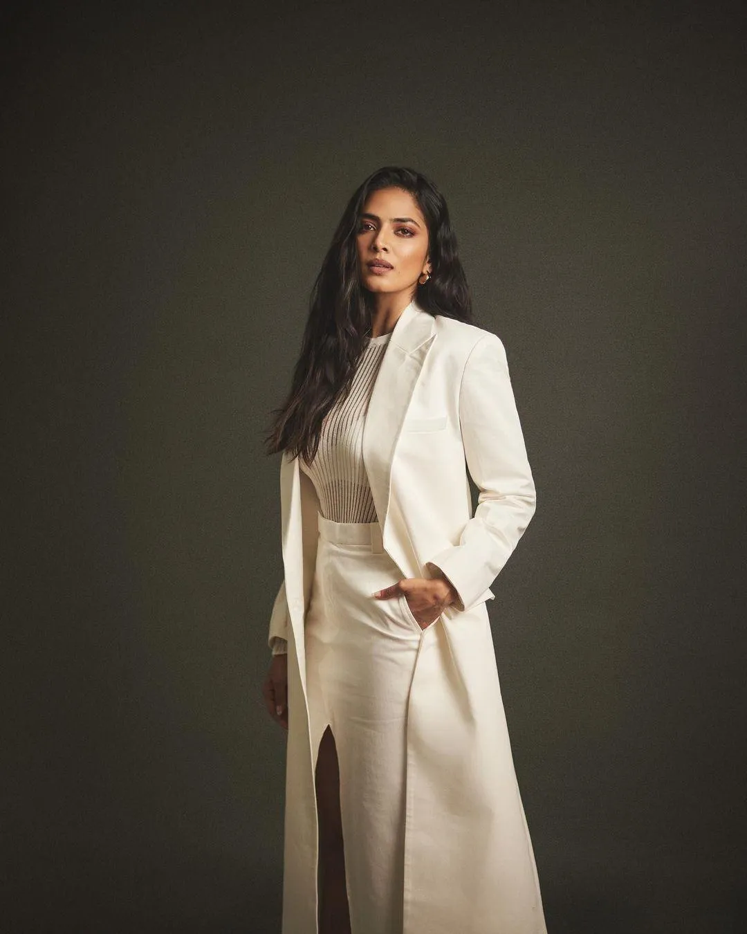 Malavika Mohanan Stylish White Outfit with Bold Attitude