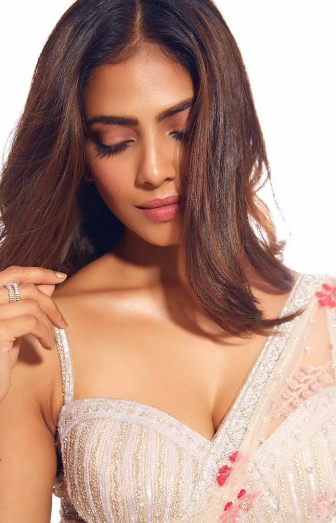 Peach Dress Elegance Displayed by Malavika Mohanan Wallpaper