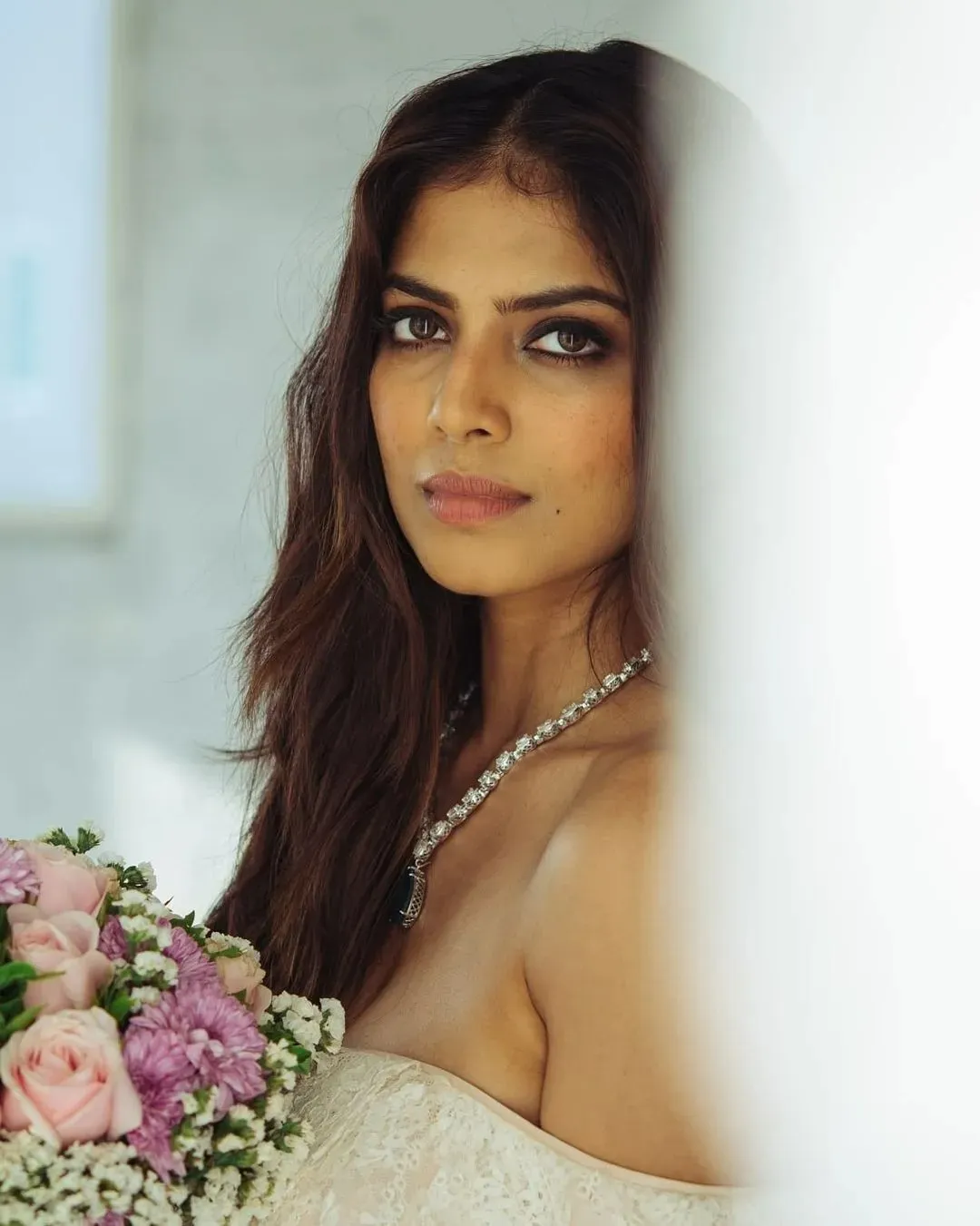 Sensual Malavika Mohanan Closeup Wearing White Dress Image