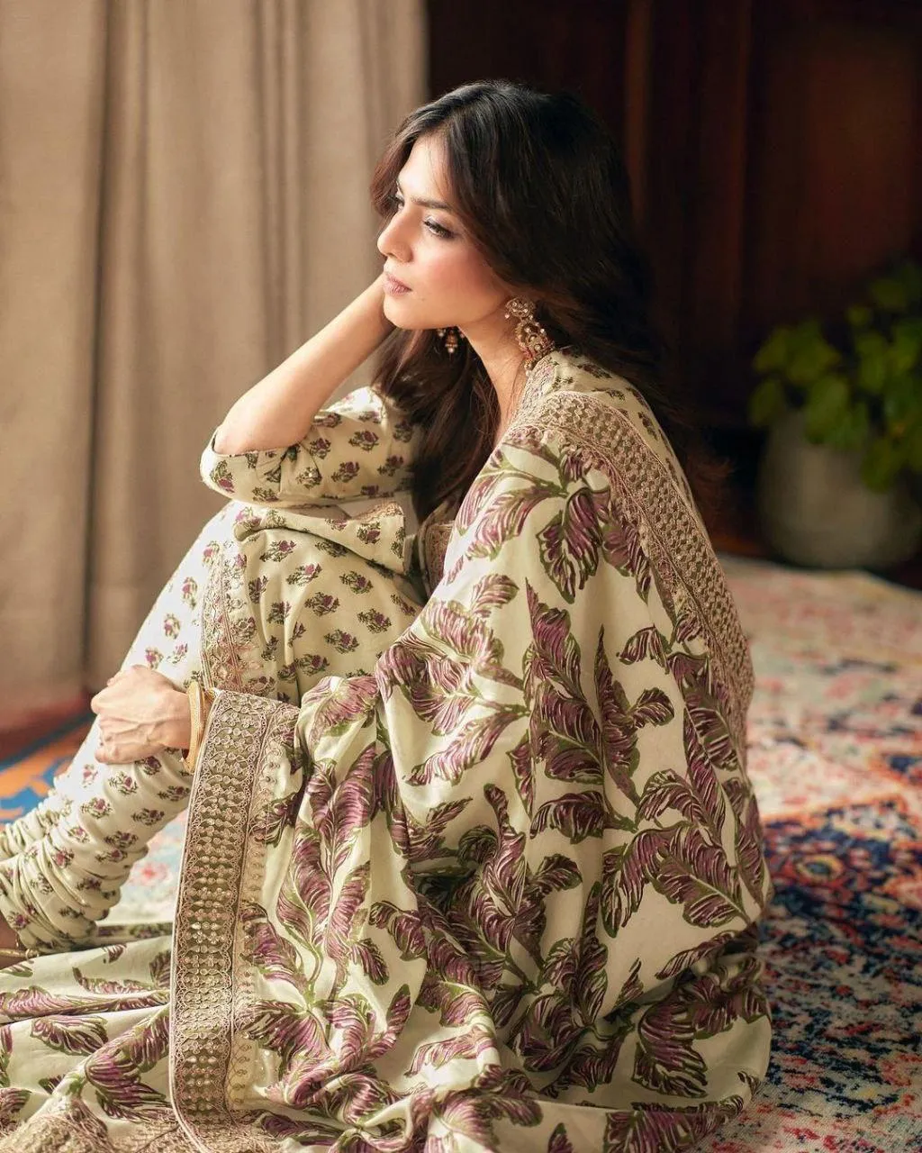 Sensual Malavika Mohanan in Beige Saree Seated Traditional