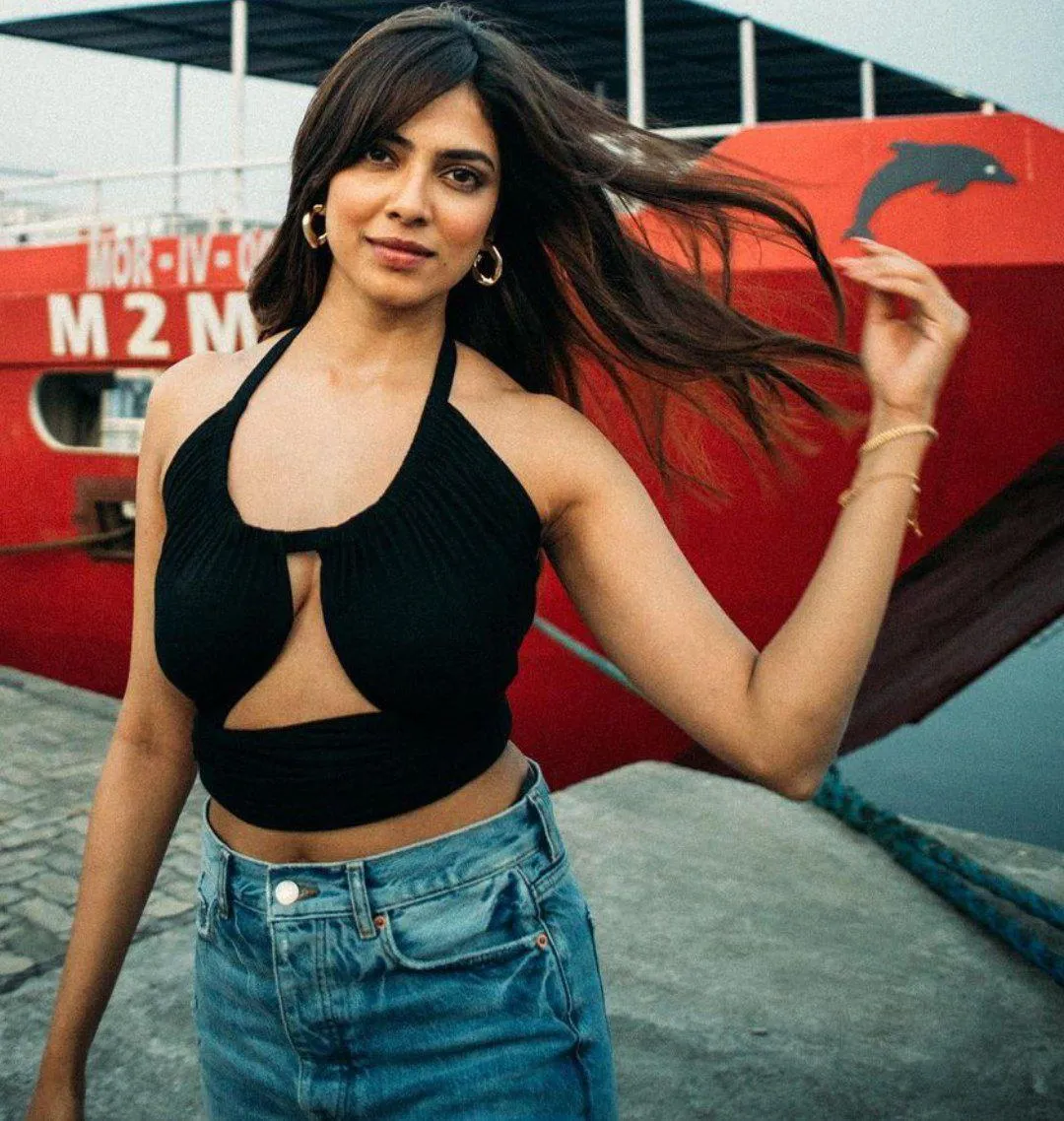 Sensual Malavika Mohanan in Black Crop Top and Jeans Image