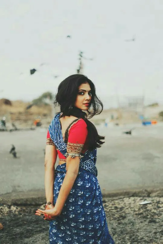 Sensual Malavika Mohanan in Blue Jeans Near Beach Posing
