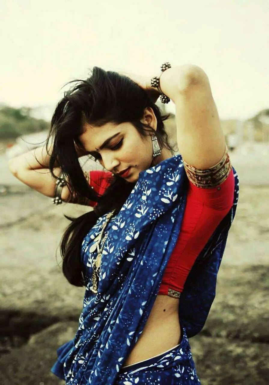 Sensual Malavika Mohanan in Blue Saree with Red Blouse Pose