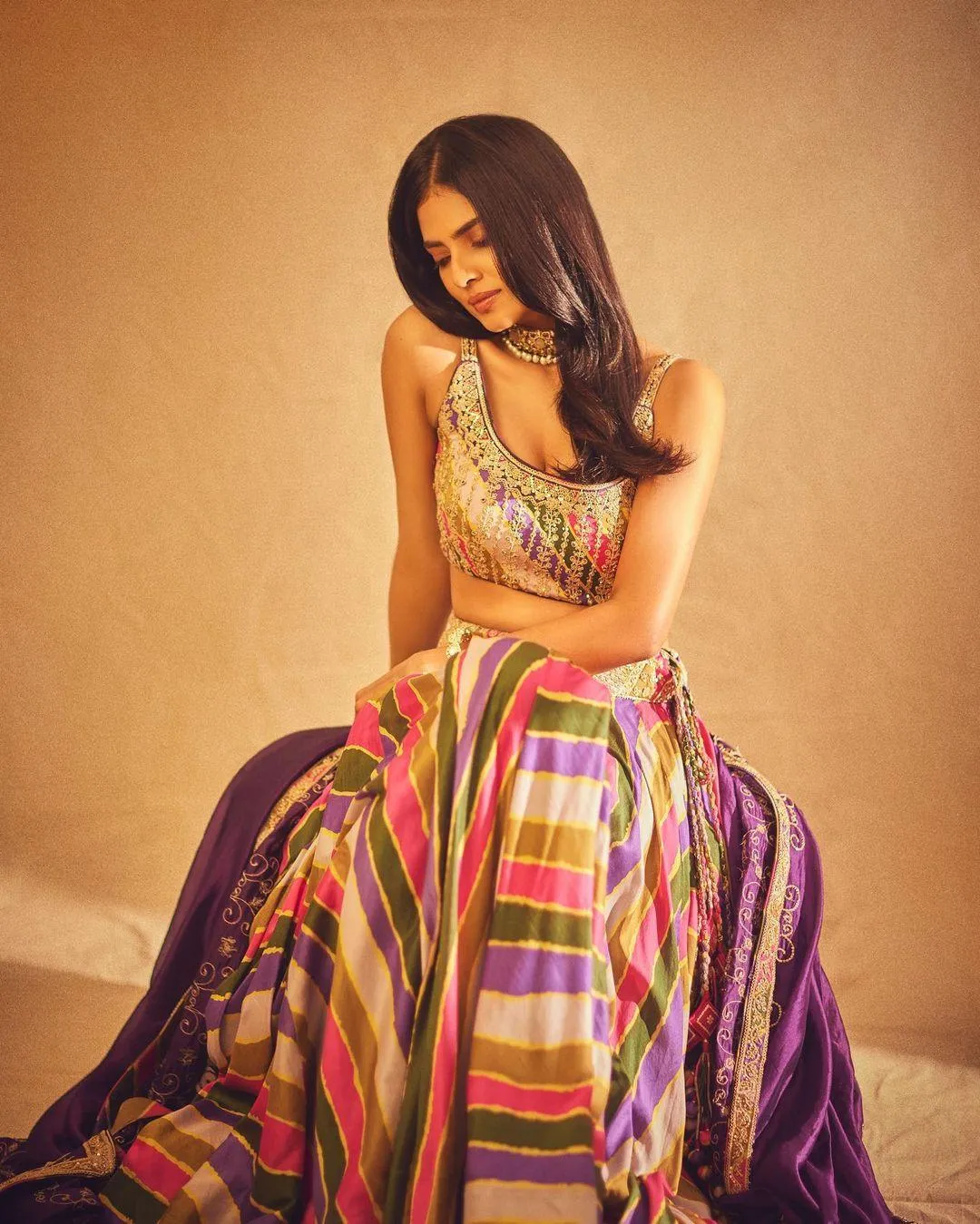 Sensual Malavika Mohanan in Ethnic Colorful Gown Sitting