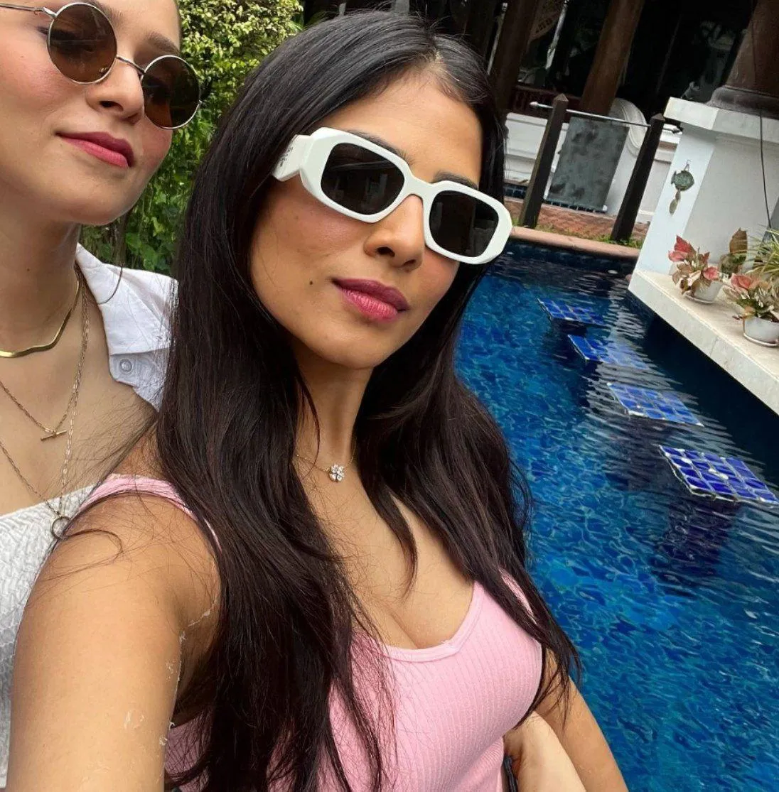 Sensual Malavika Mohanan in Pink Top with White Sunglasses