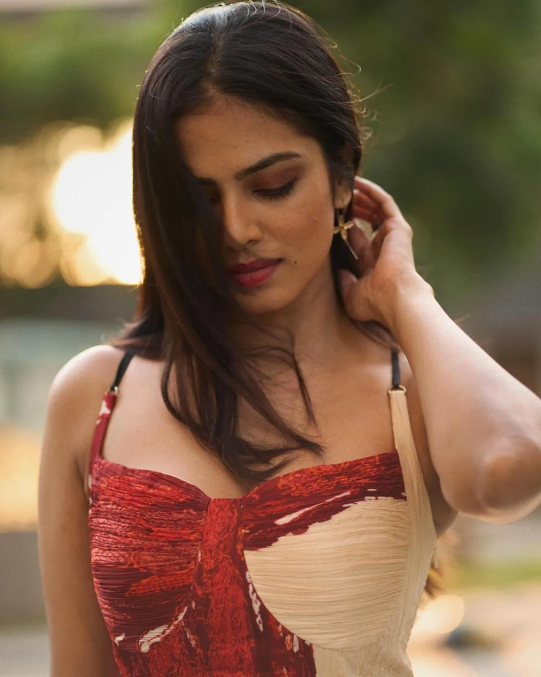 Sensual Malavika Mohanan in Red Corset Top with Soft Smile