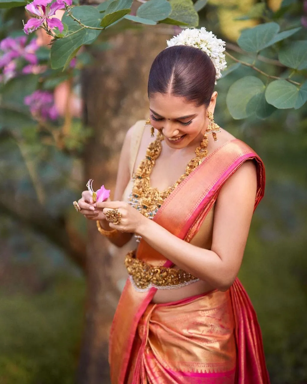 Sensual Malavika Mohanan in Red Saree with Jewelry Pose