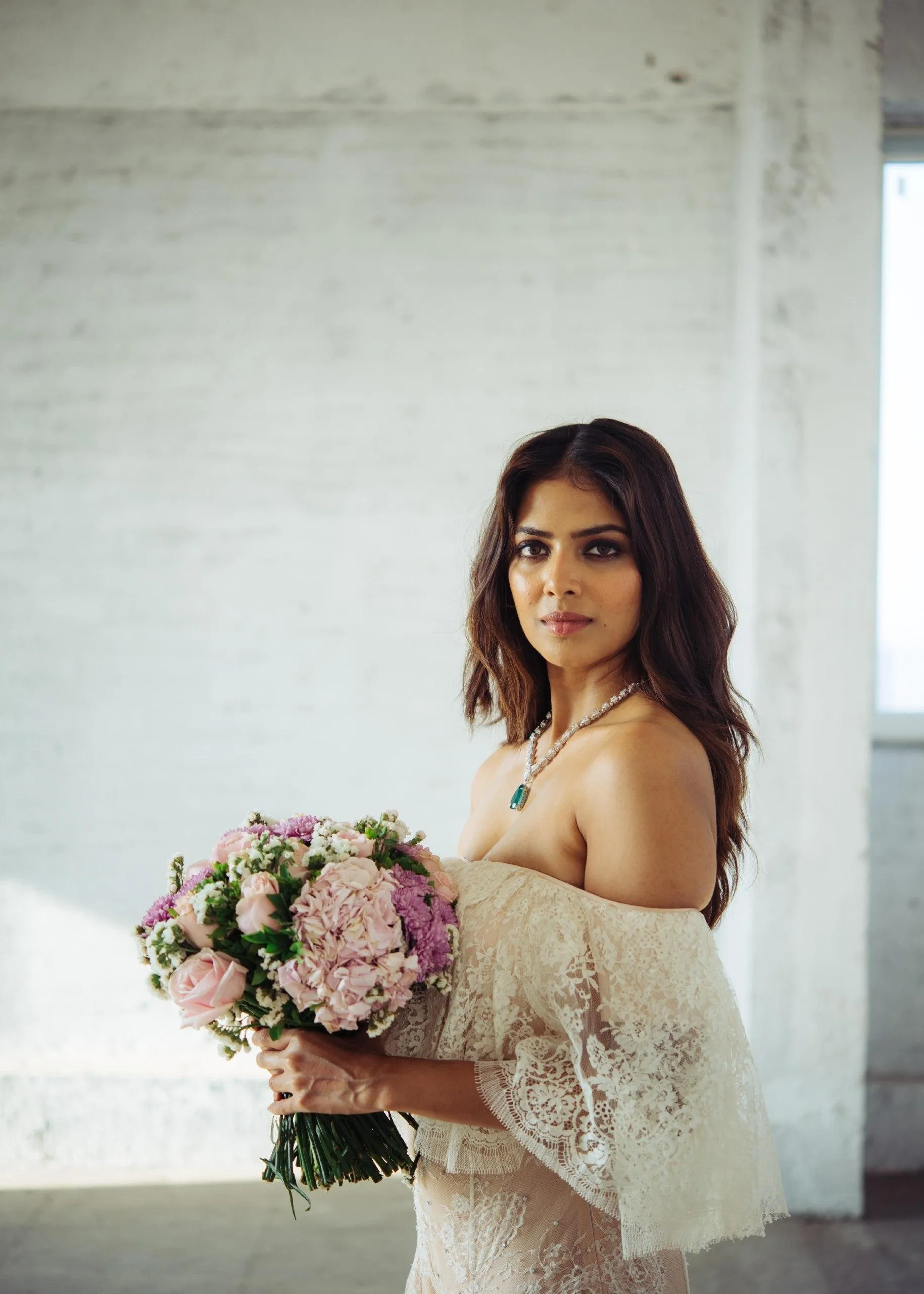 Sensual Malavika Mohanan in White Floral Dress with Bouquet