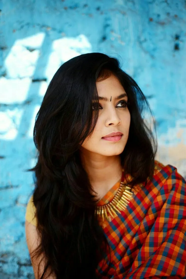 Sensual Malavika Mohanan Posing in Red Printed Outfit Style