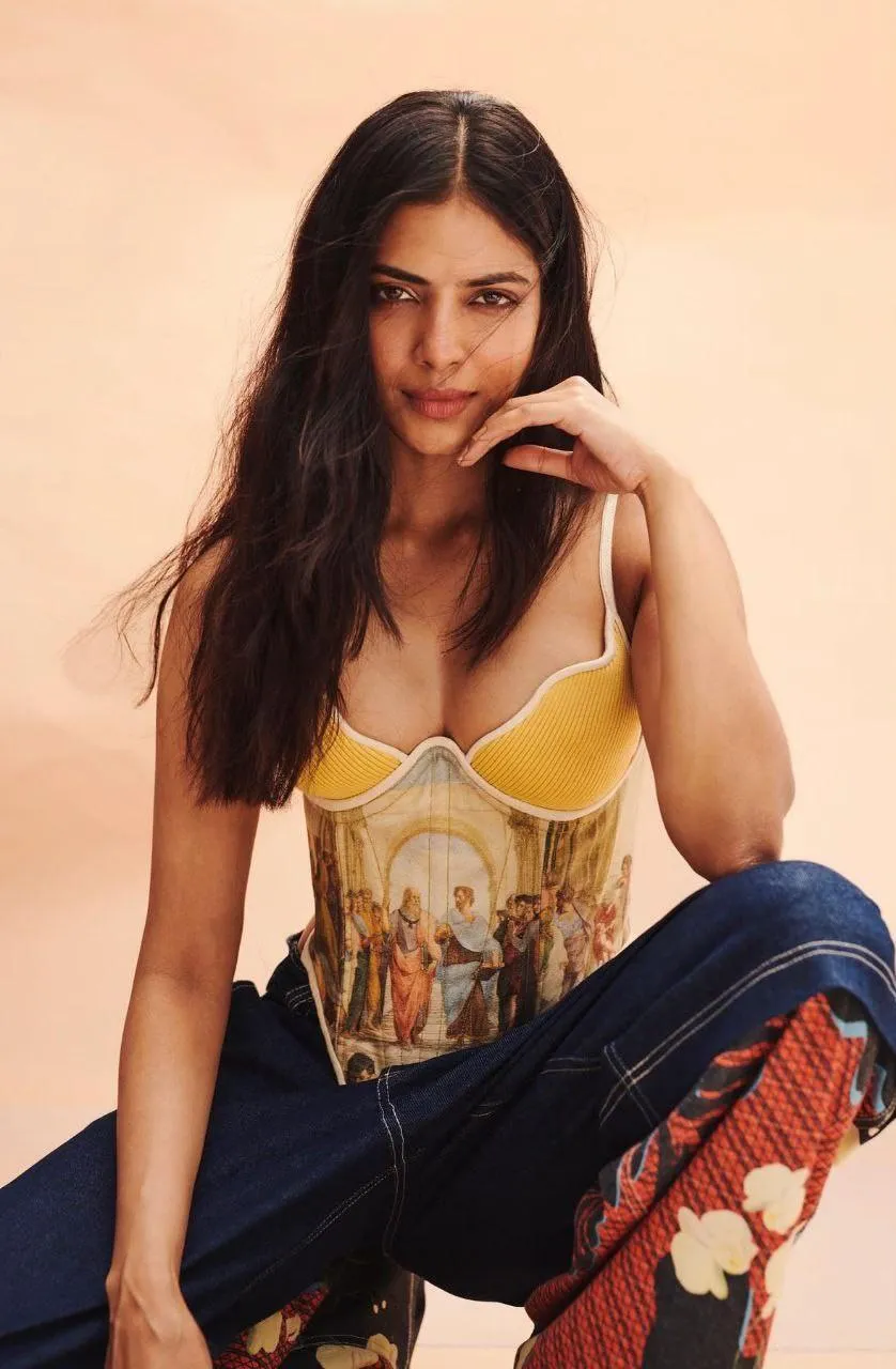 Sensual Malavika Mohanan Seated Pose in Casual Chic Wear