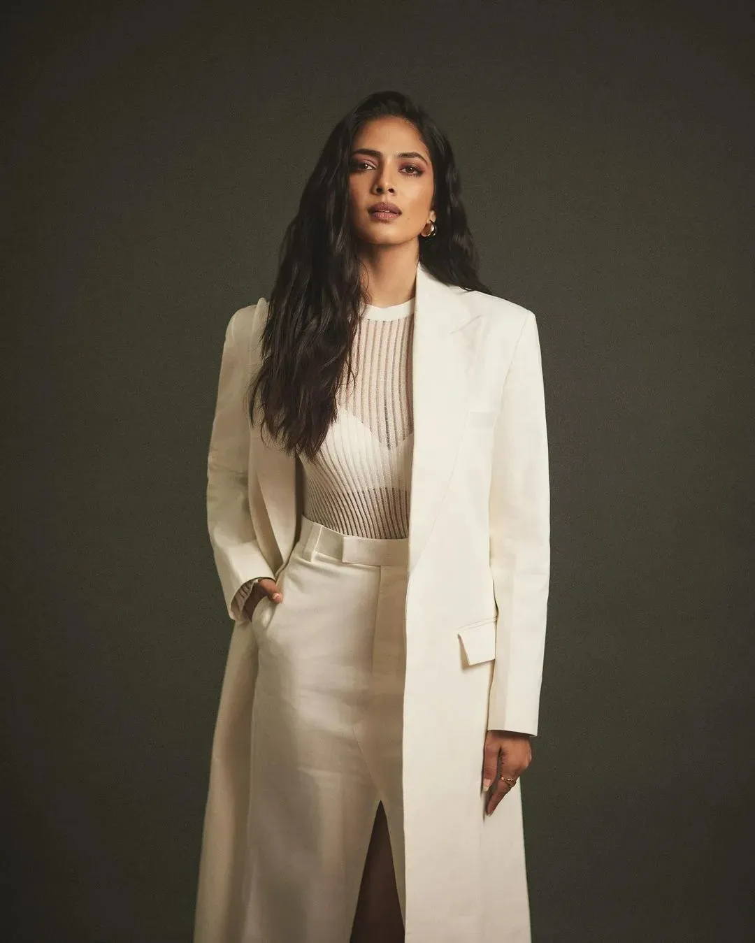 Sensual Malavika Mohanan Wearing Long White Coat and Dress