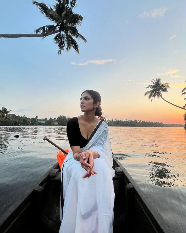 Stunning Malavika Mohanan At Beach Wearing White Dress