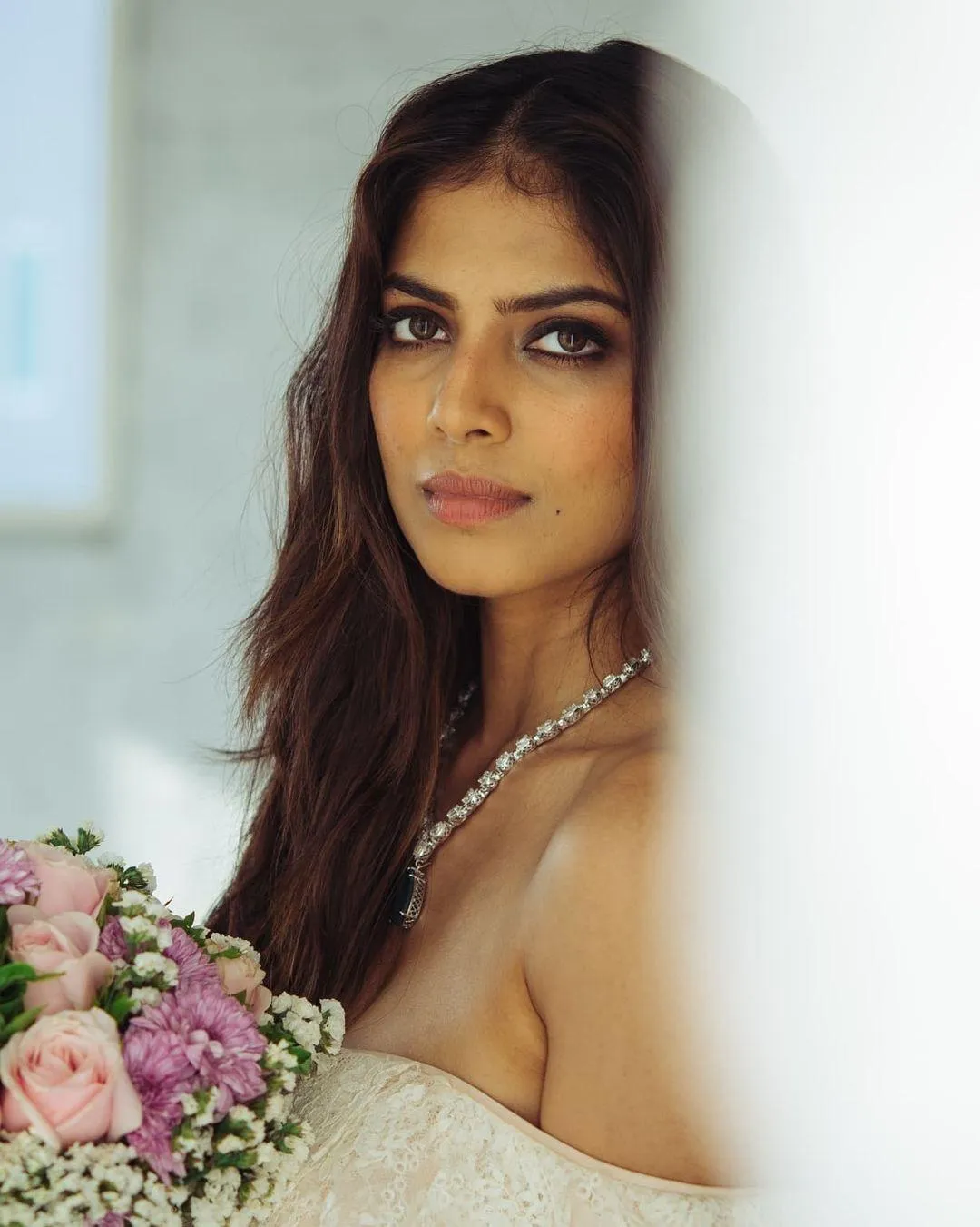 Stunning Malavika Mohanan Gorgeous Floral Outdoor Pose Image