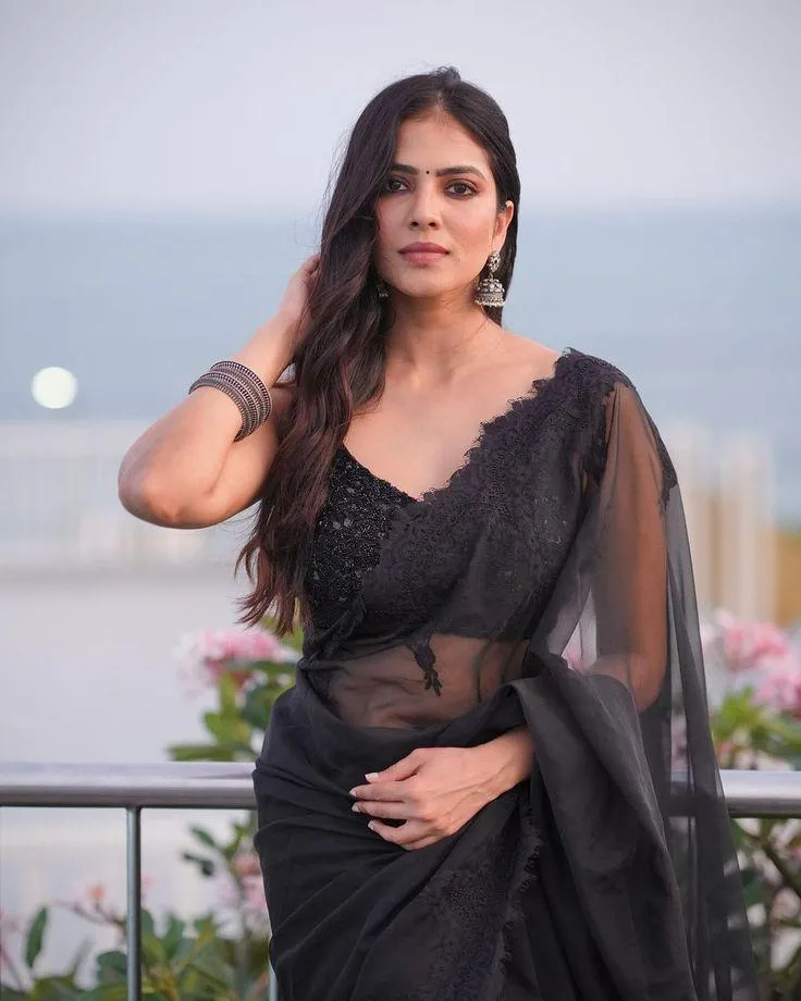 Stunning Malavika Mohanan in Black Saree Elegant Charm Image