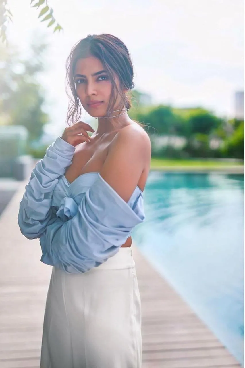 Stunning Malavika Mohanan in Blue Top with City Behind Image