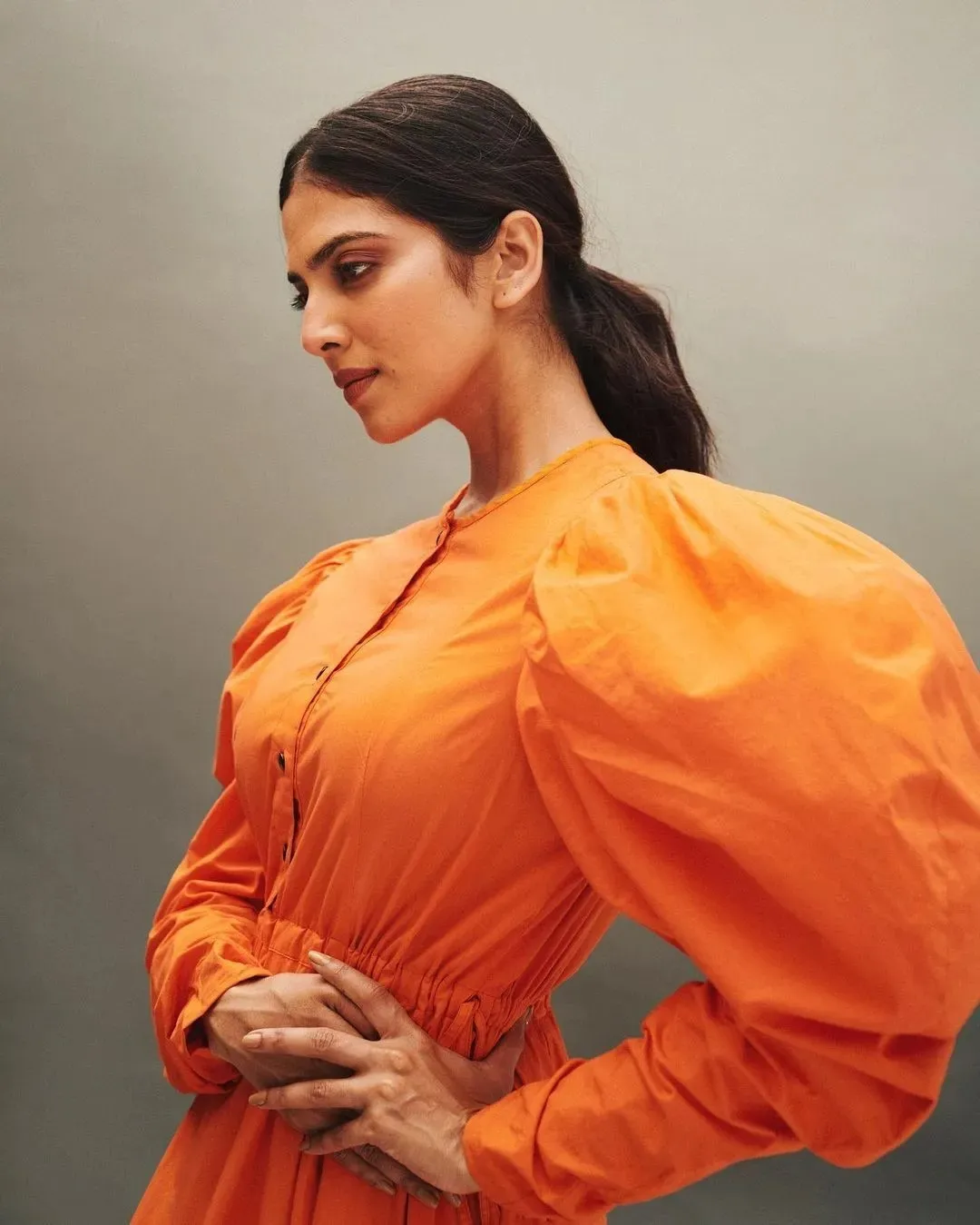 Stunning Malavika Mohanan in Bright Orange Puff Sleeve Dress