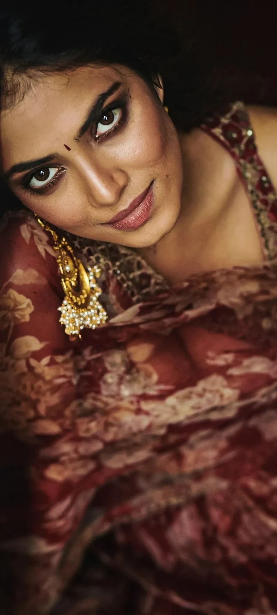Stunning Malavika Mohanan in Deep Red Saree and Jewels Image