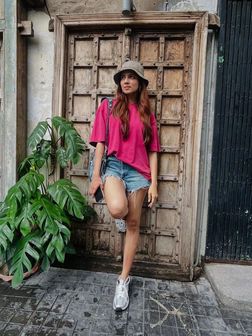 Stunning Malavika Mohanan in Denim Shorts Street Posing