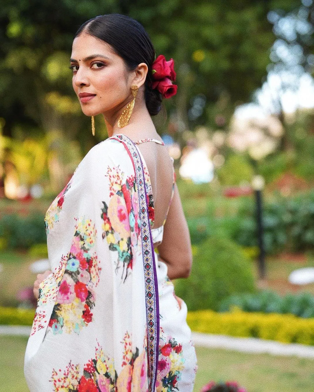 Stunning Malavika Mohanan in Floral Saree Outdoor Beauty
