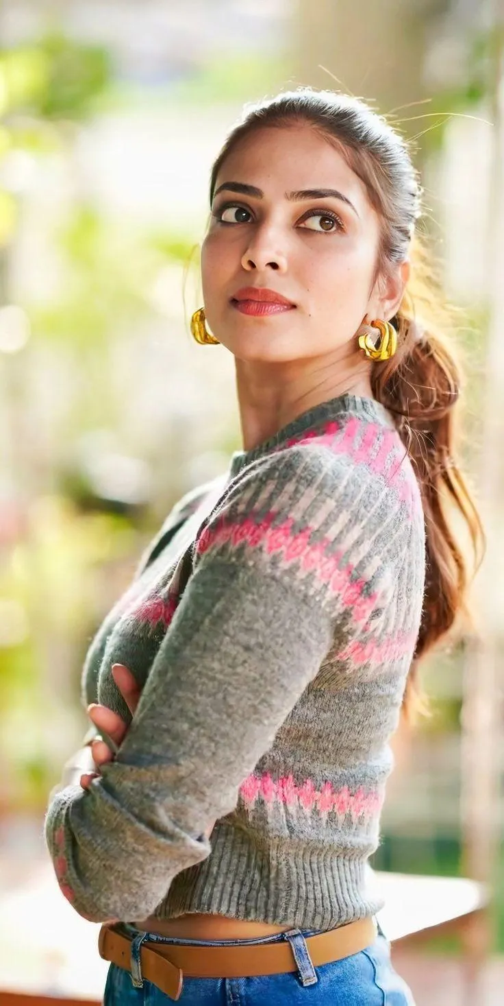 Stunning Malavika Mohanan in Grey Sweater Casual Street Pose