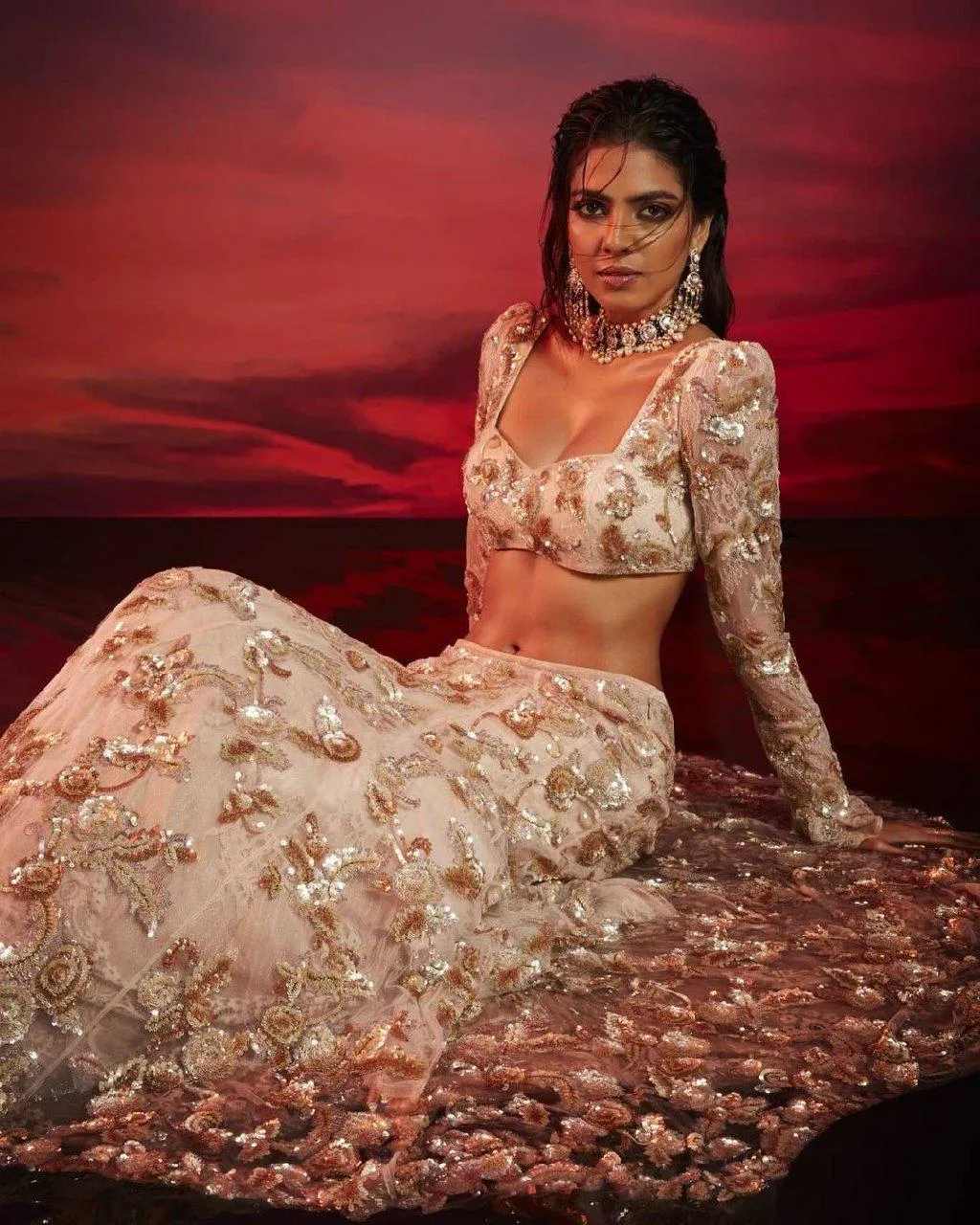 Stunning Malavika Mohanan in Heavy Lehenga Red Backdrop