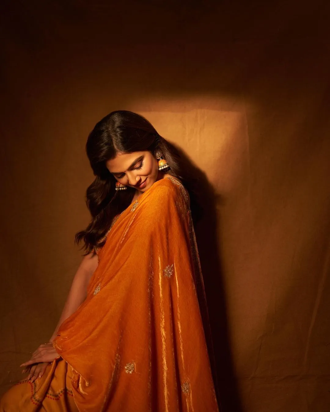 Stunning Malavika Mohanan in Orange Gown Bold Style Picture