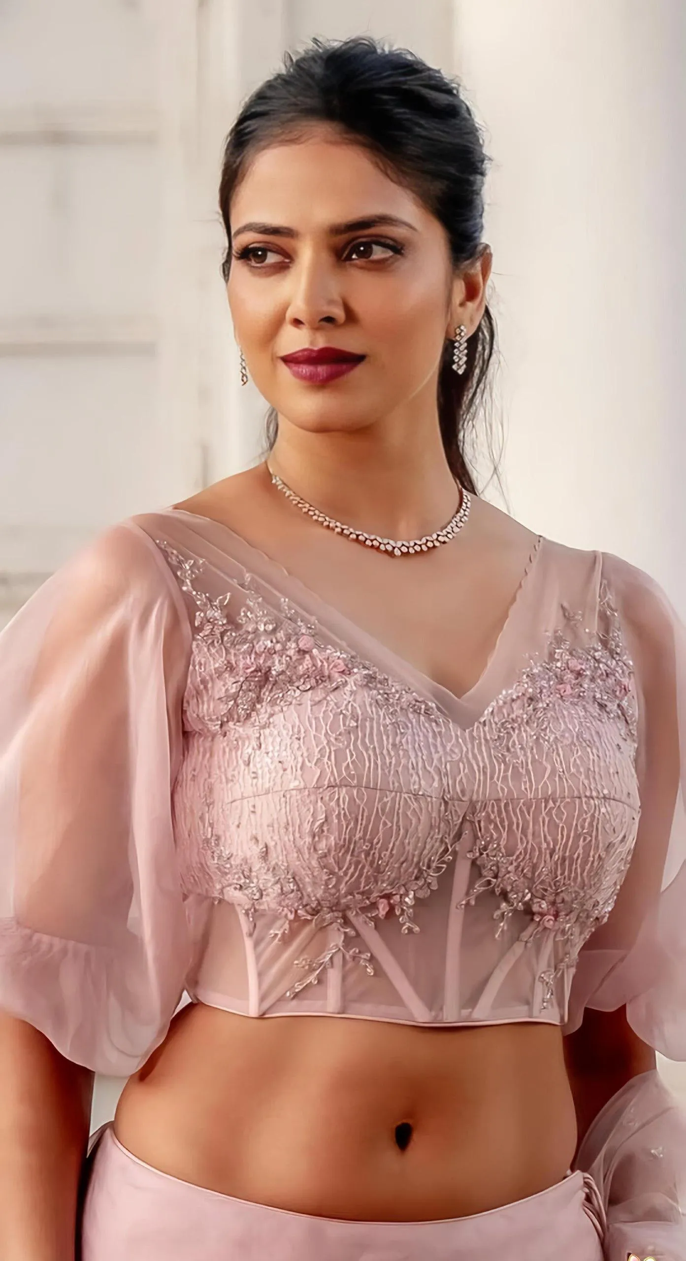 Stunning Malavika Mohanan in Pink Blouse with Elegant Smile
