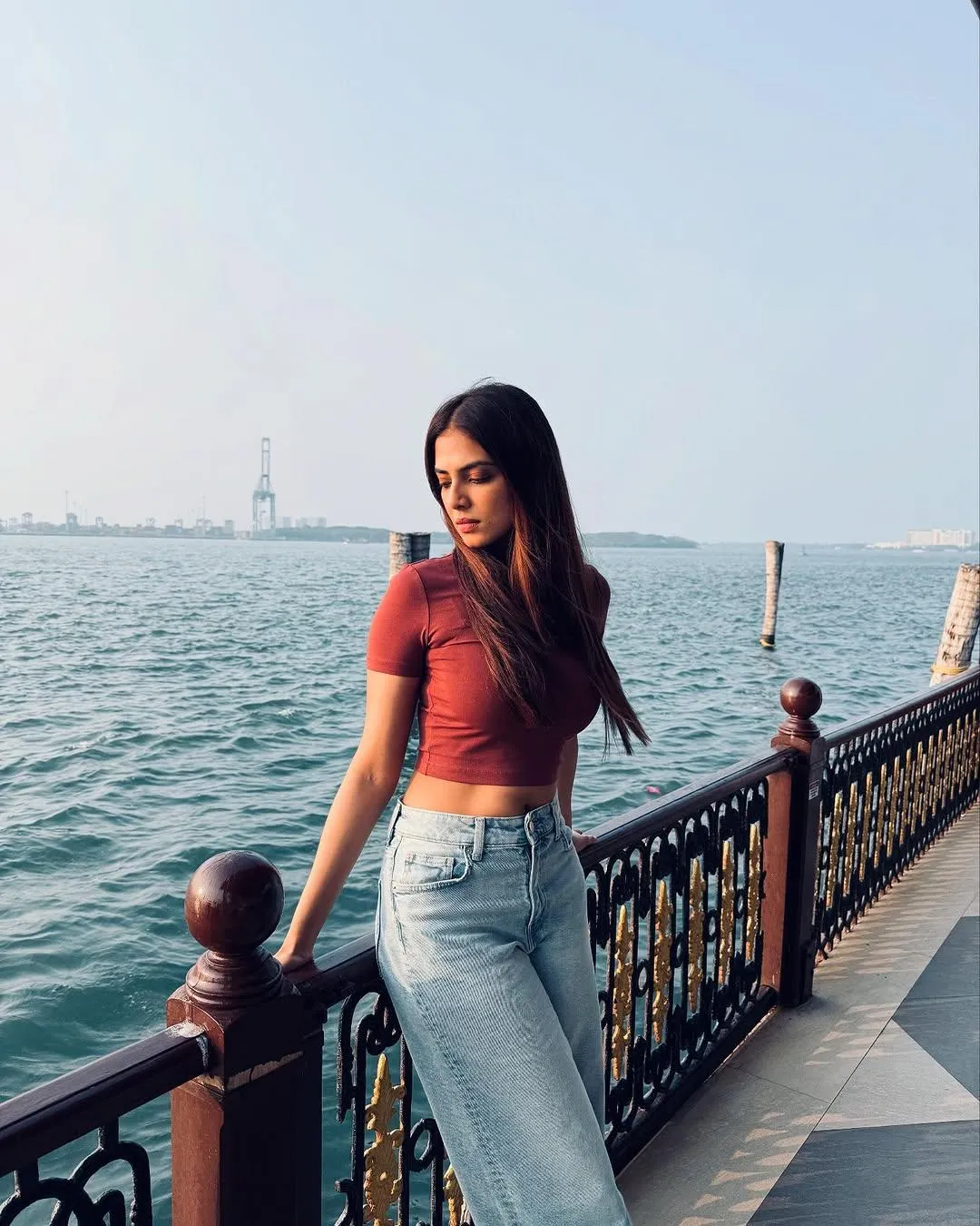 Stunning Malavika Mohanan in Red Gown Ocean Backdrop Picture