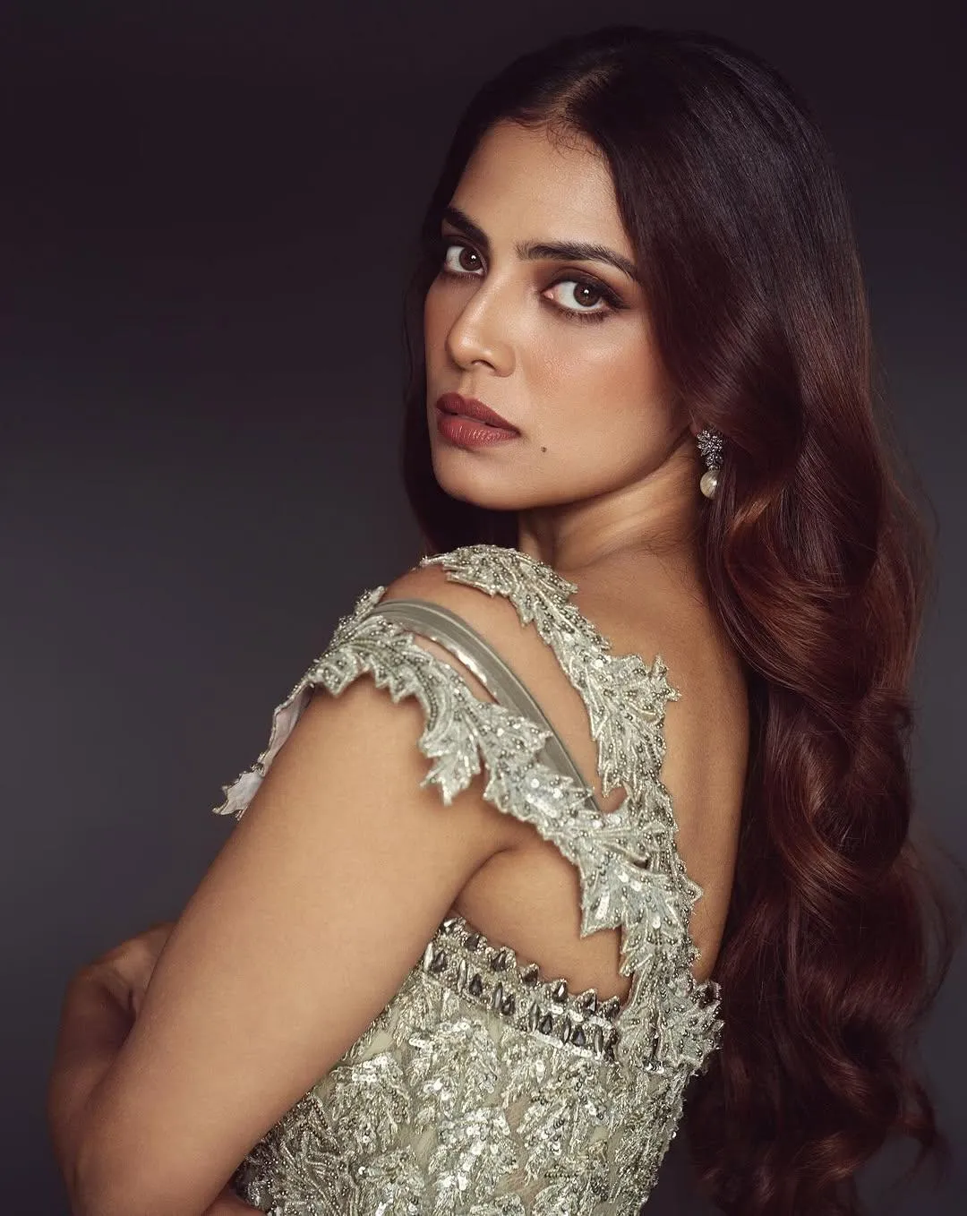 Stunning Malavika Mohanan in Silver Gown with Bold Pose