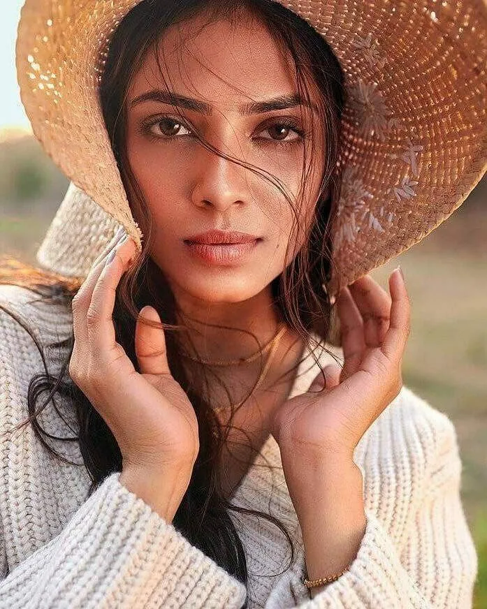 Stunning Malavika Mohanan in Straw Hat Floral Printed Top