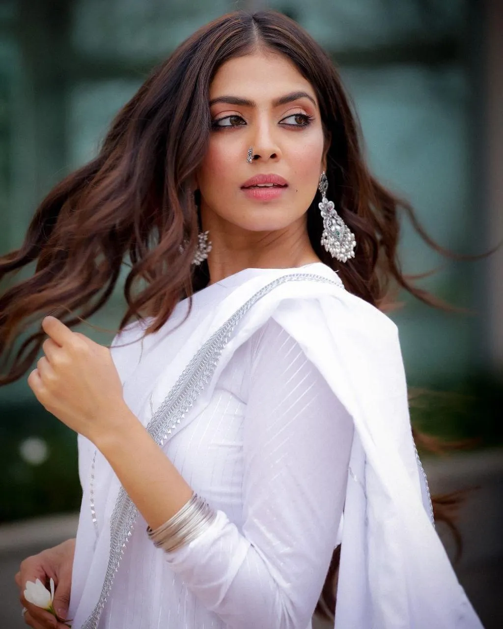 Stunning Malavika Mohanan in White Saree Elegant Smiling
