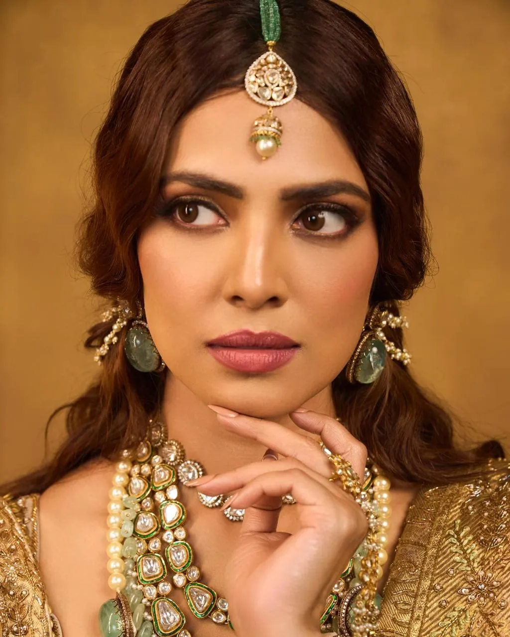 Stunning Malavika Mohanan Striking Portrait in Golden Set