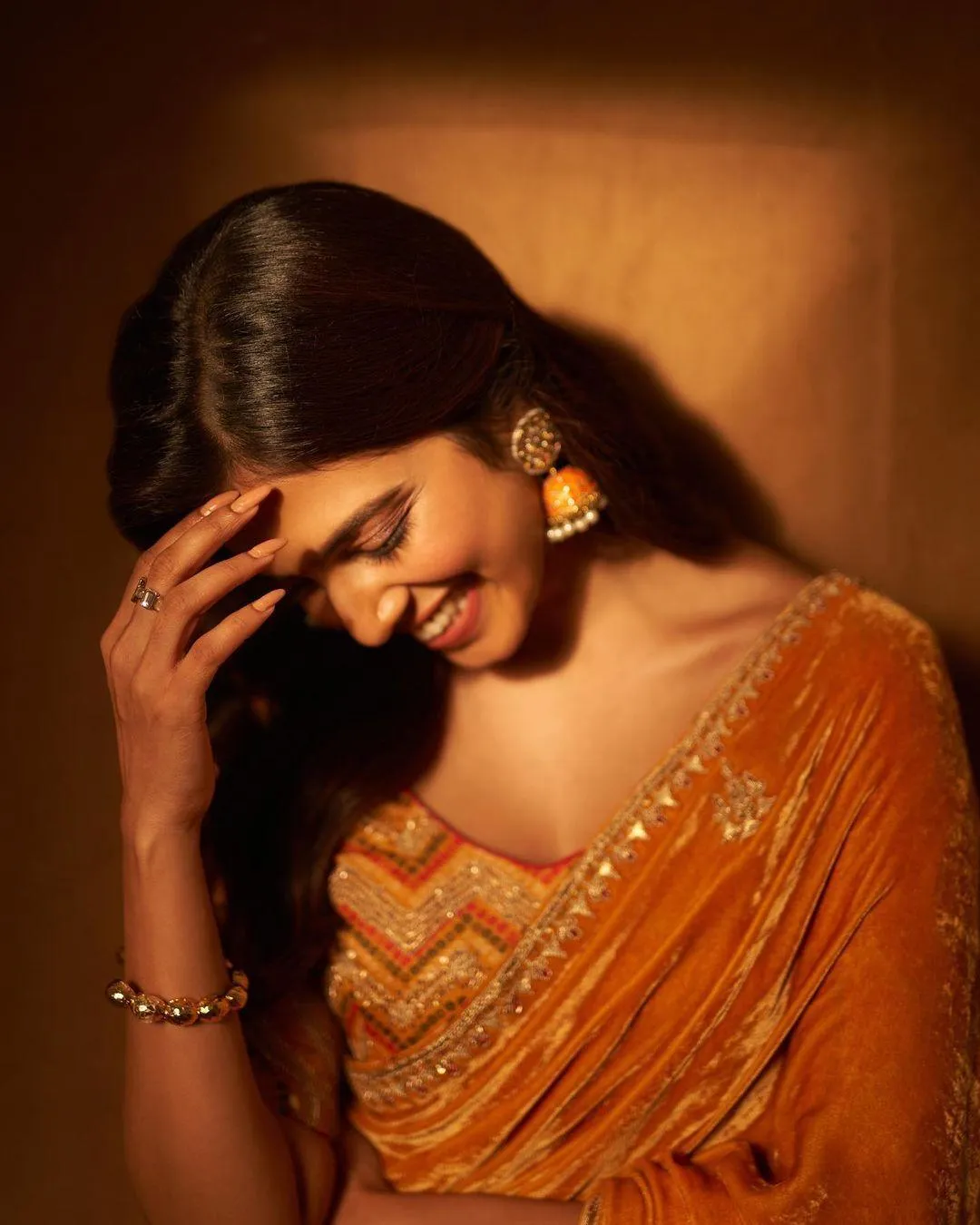 Stunning Malavika Mohanan Wearing Orange Saree Graceful