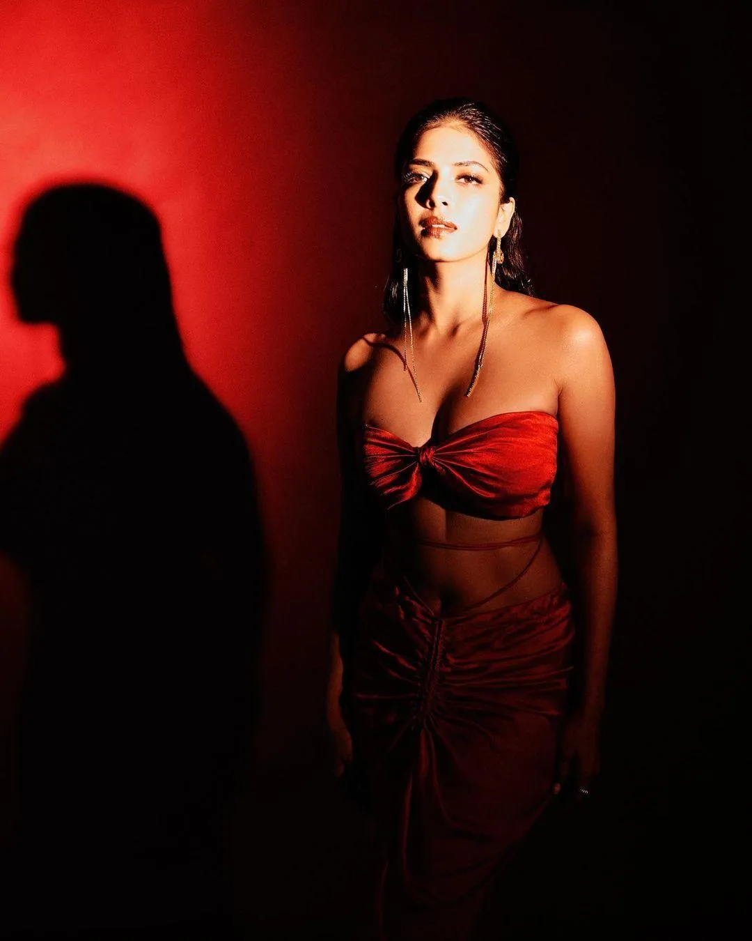 Stunning Malavika Mohanan Wearing Red Dress in Dark Lighting