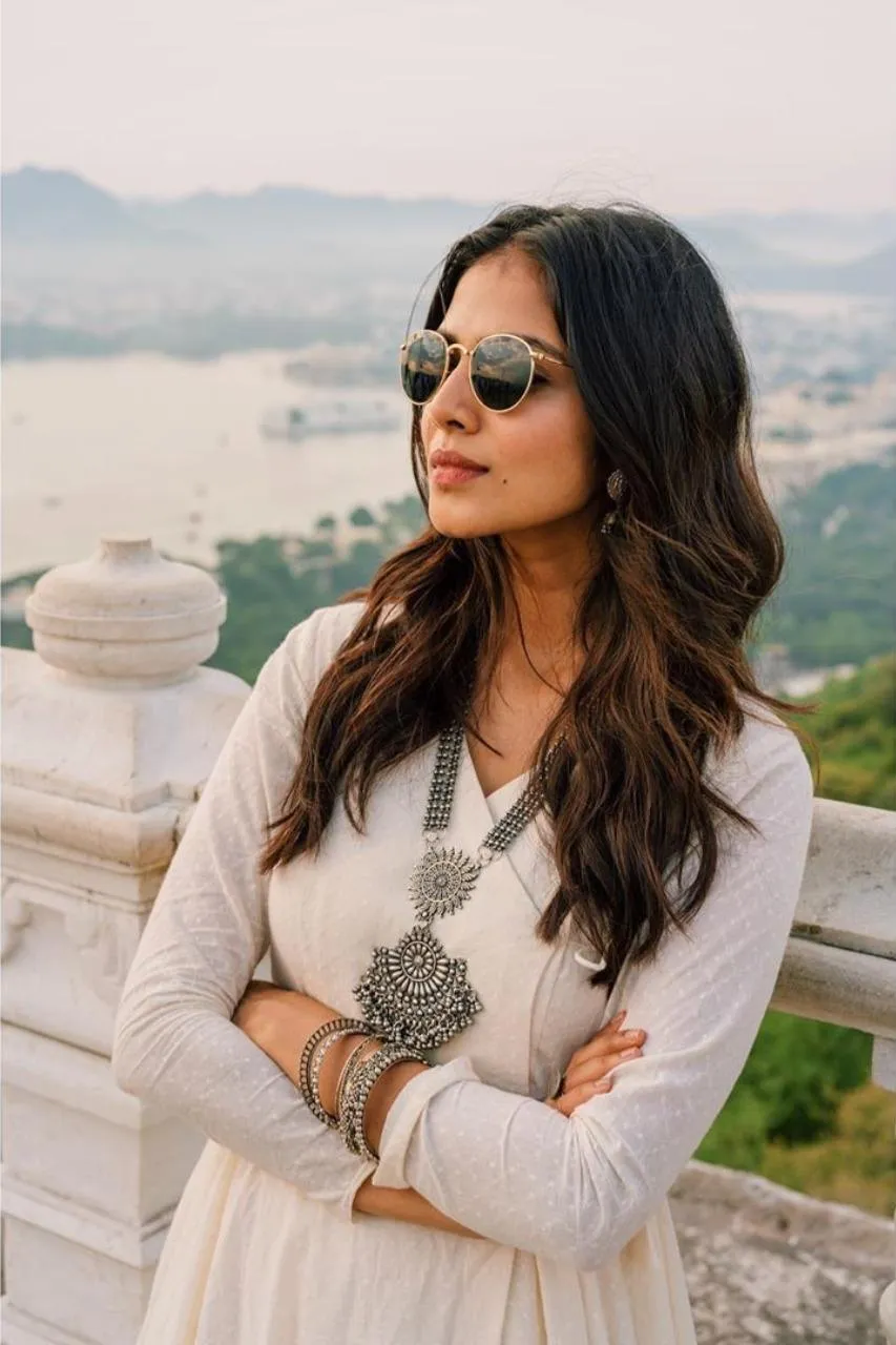 Stunning Malavika Mohanan Wearing White Dress Outdoors Image