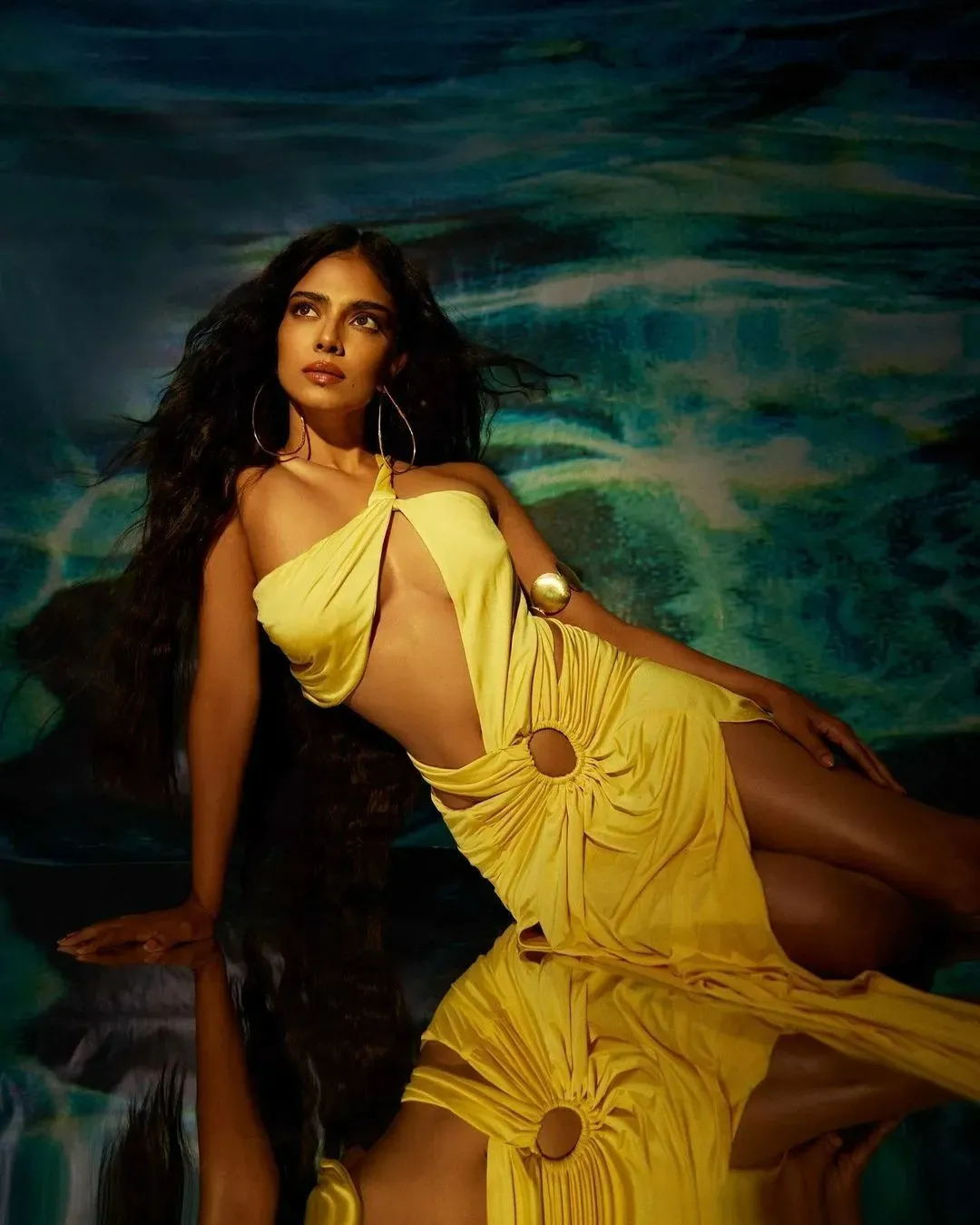 Sultry Malavika Mohanan Glows in Yellow Dress by Ocean View