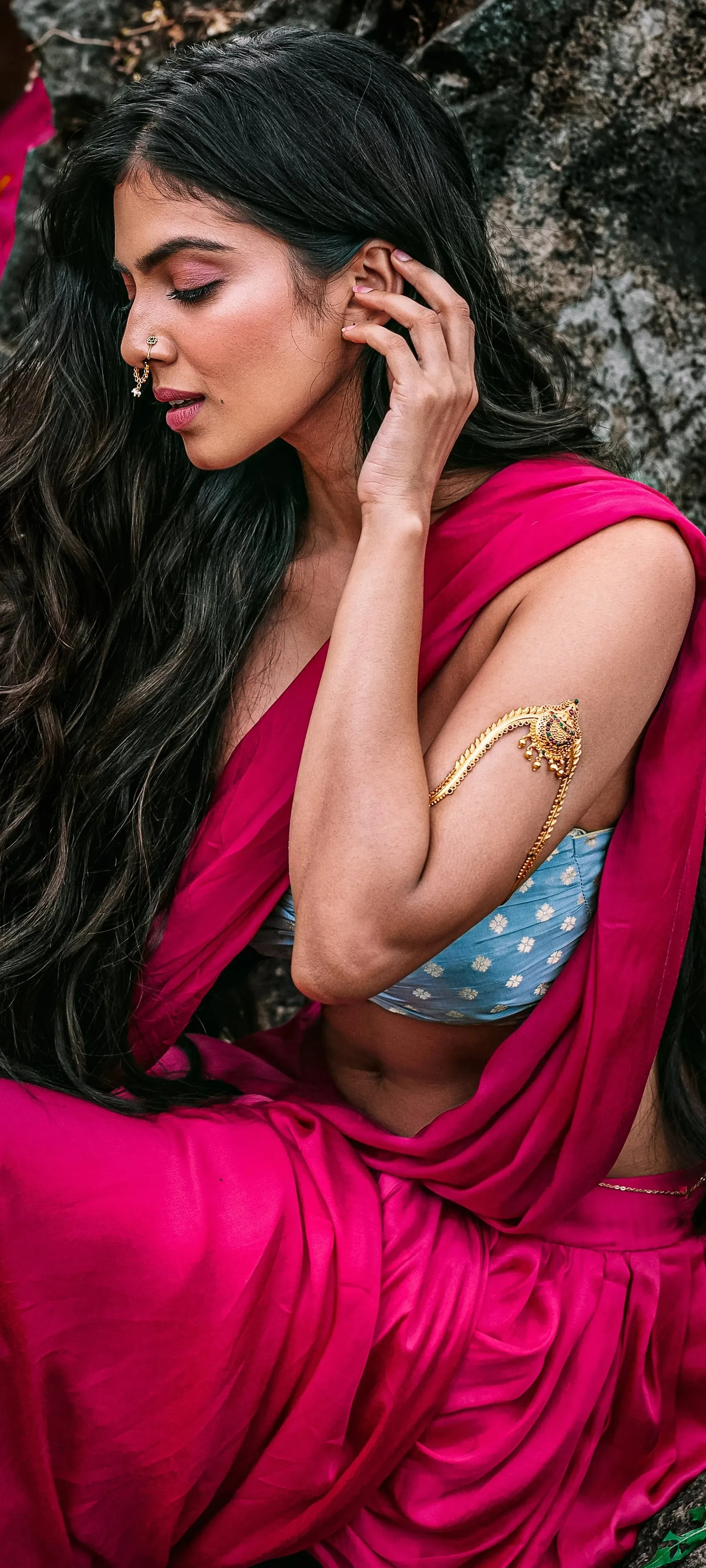 Sultry Malavika Mohanan in Elegant Pink Dress Sitting Pose
