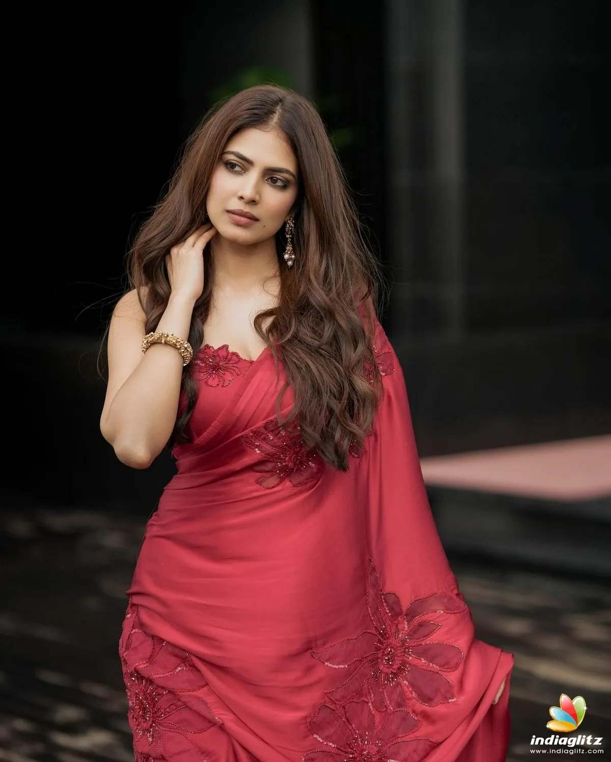 Sultry Malavika Mohanan in Elegant Red Dress Walking Image
