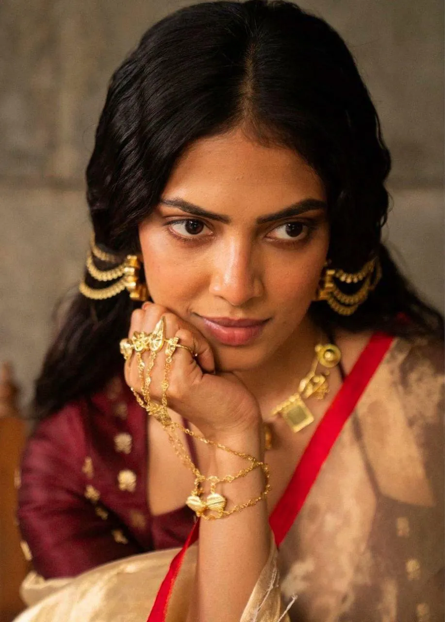 Sultry Malavika Mohanan in Golden Saree Elegant Smile