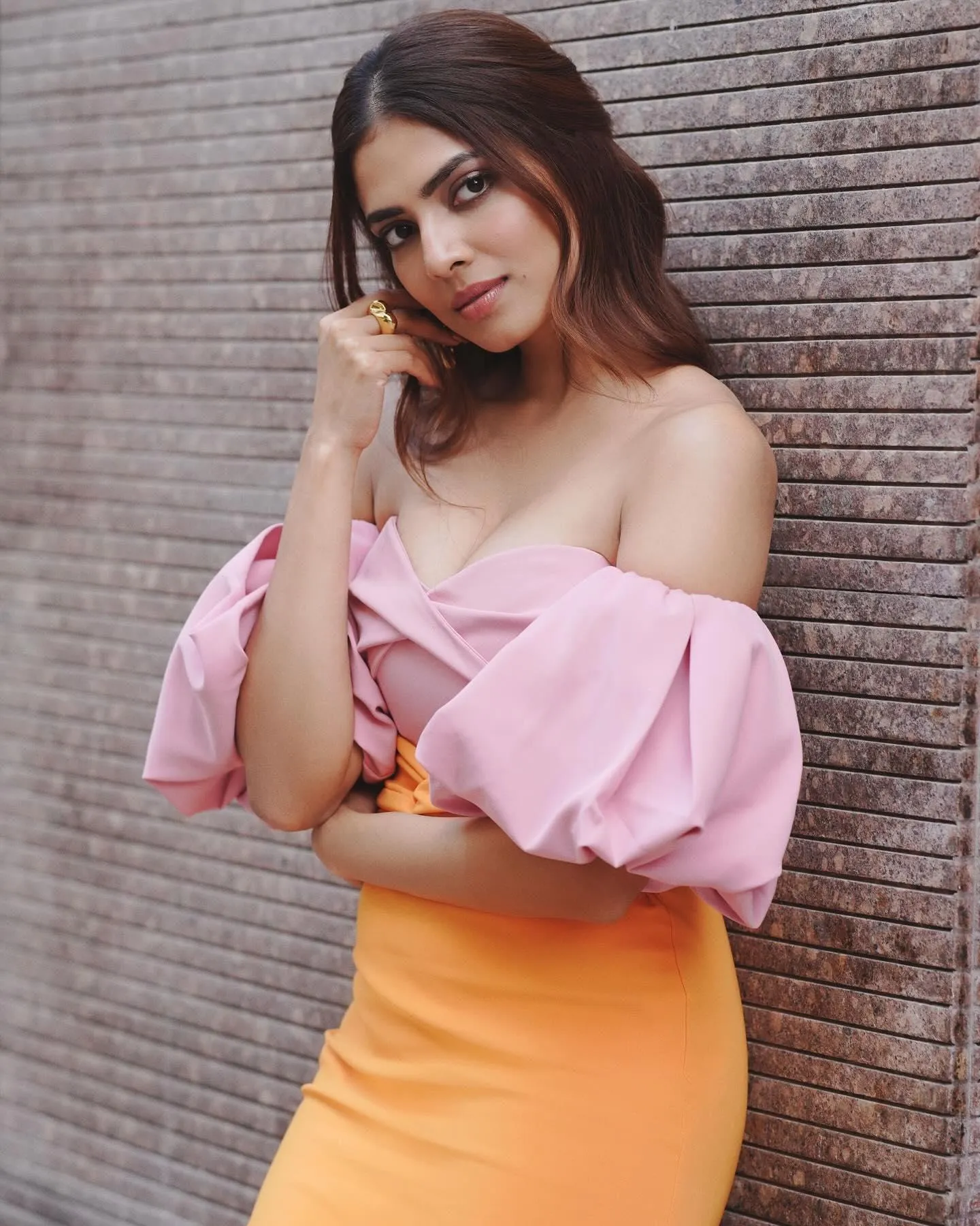 Sultry Malavika Mohanan in Pink Top and Yellow Skirt Pose