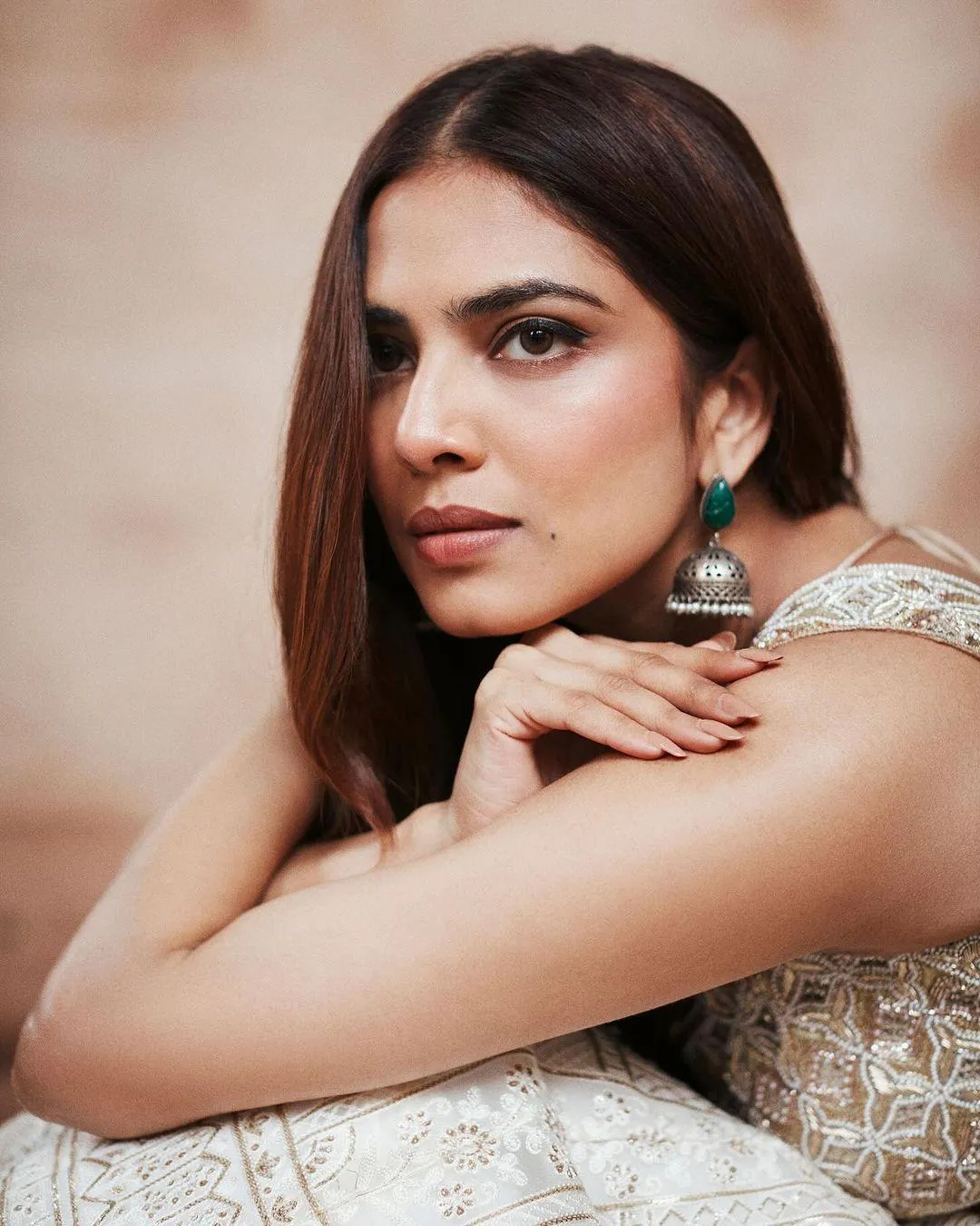 Sultry Malavika Mohanan in Sleeveless Golden Outfit Pose
