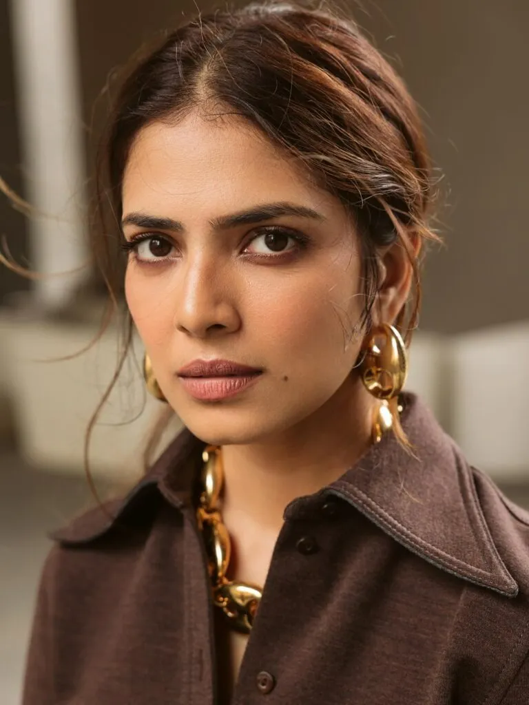Sultry Malavika Mohanan in Tan Blouse with Sharp Look Image