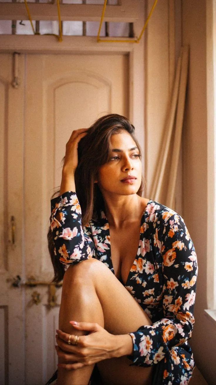 Sultry Malavika Mohanan in Yellow Top with Golden Curtain
