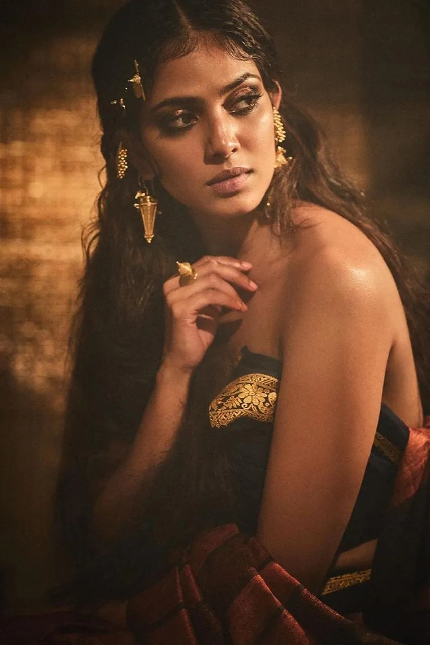 Sultry Malavika Mohanan Posing Dramatically in Brown Dress