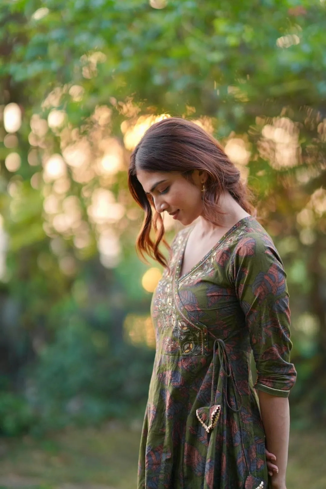 Sultry Malavika Mohanan Standing in Nature with Soft Smile