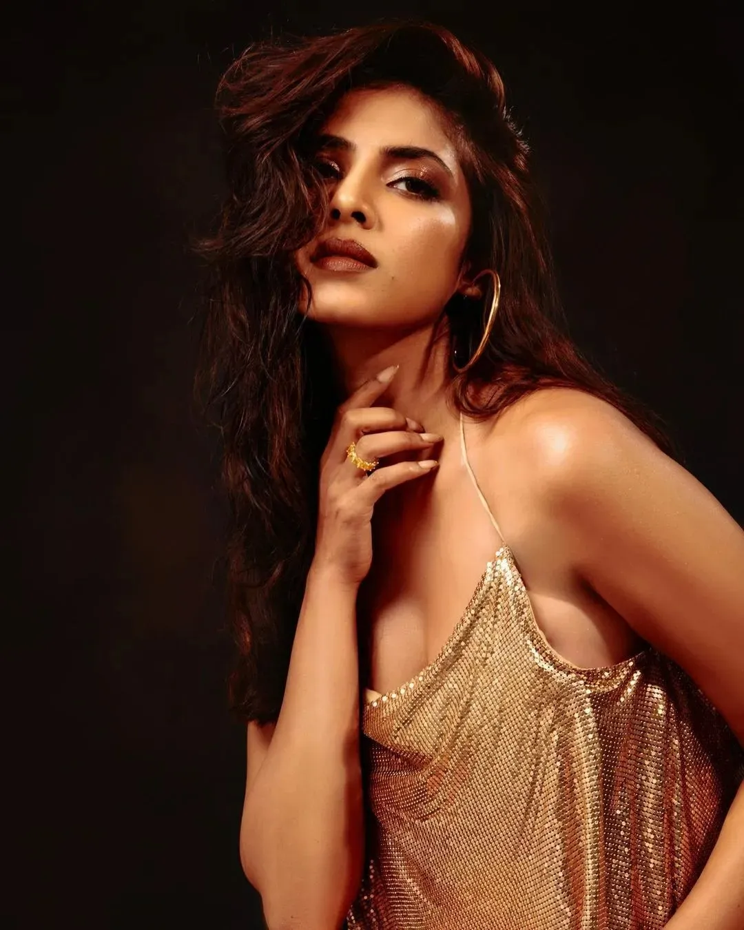 Sultry Malavika Mohanan Strikes Pose in Elegant Modern Dress
