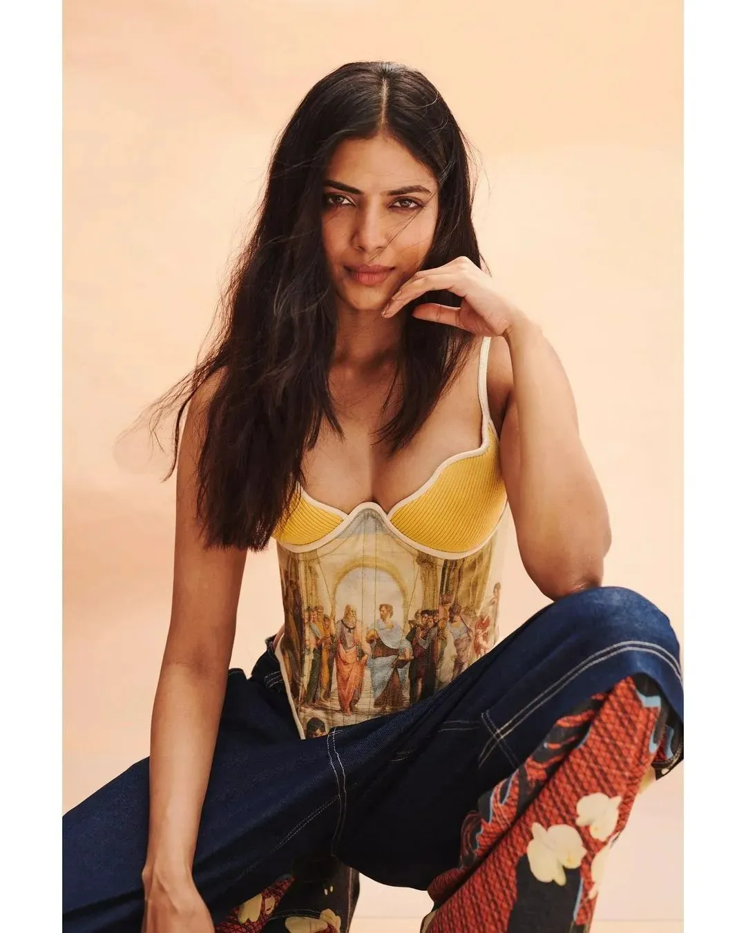 Sultry Malavika Mohanan Wearing Yellow Top and Blue Jeans