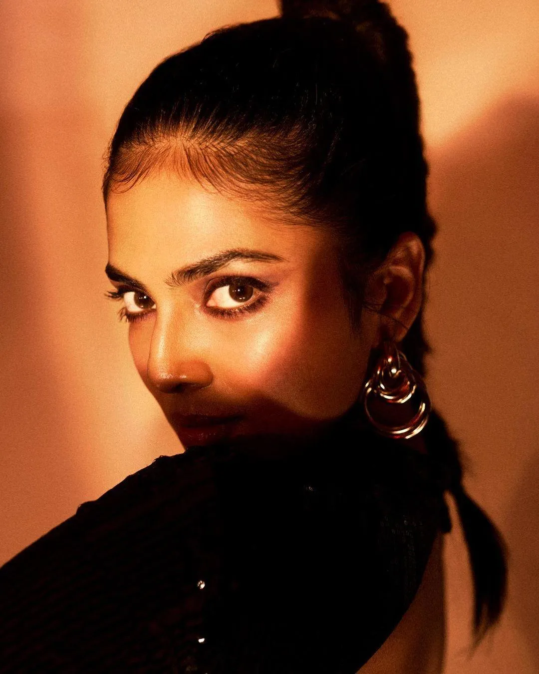Tempting Malavika Mohanan in Black Dress Classic Pose