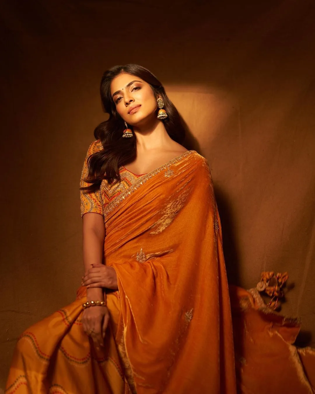 Tempting Malavika Mohanan in Orange Gown Elegant Fashion