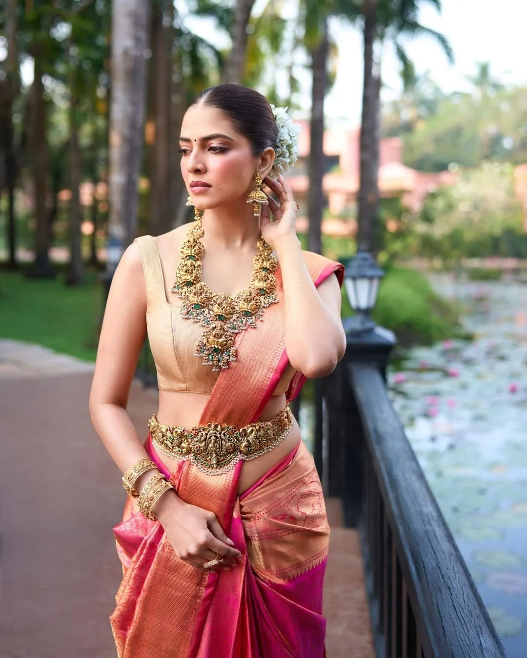 Tempting Malavika Mohanan in Red Saree Outdoor Elegance